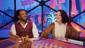 Xavier Woods and Bayley look excited on the set of Dimension 20: Titan Takedown.