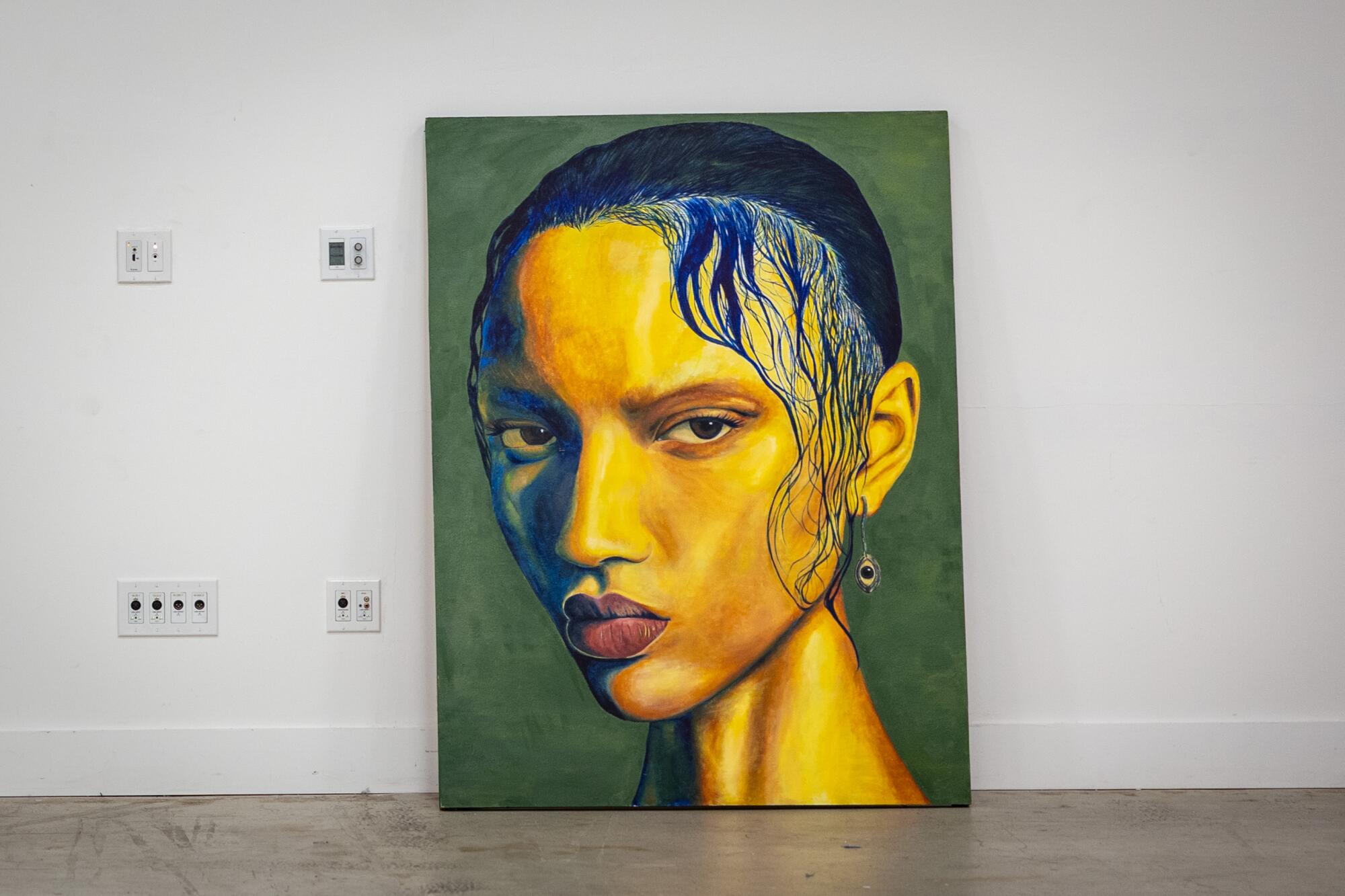 A painting titled "See Through You" by Alé Reviere shows a woman staring with strands of blue hair hanging down her cheek.