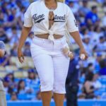

Lizzo threw the honorary first pitch before the regular-season MLB game between the Los Angeles Dodgers and the San Diego Padres on Thursday, June 19, 2025, at Dodger Stadium in Los Angeles, California.